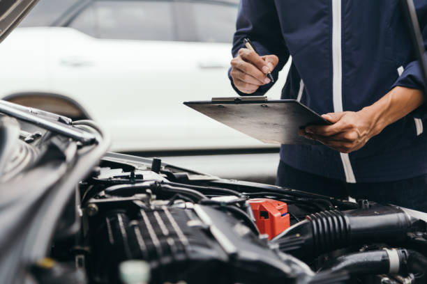 Automobile mechanic repairman hands repairing a car engine automotive workshop with a wrench, car service and maintenance,Repair service.